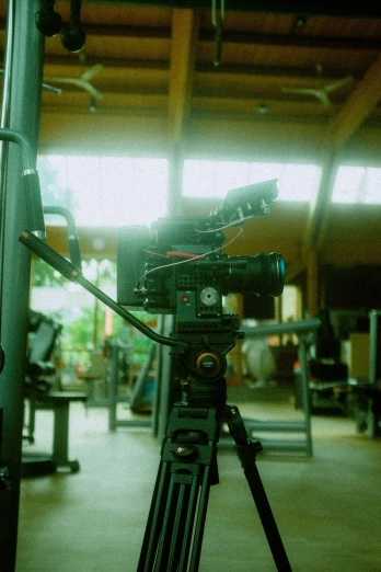 a camera is sitting on a tripod in the garage