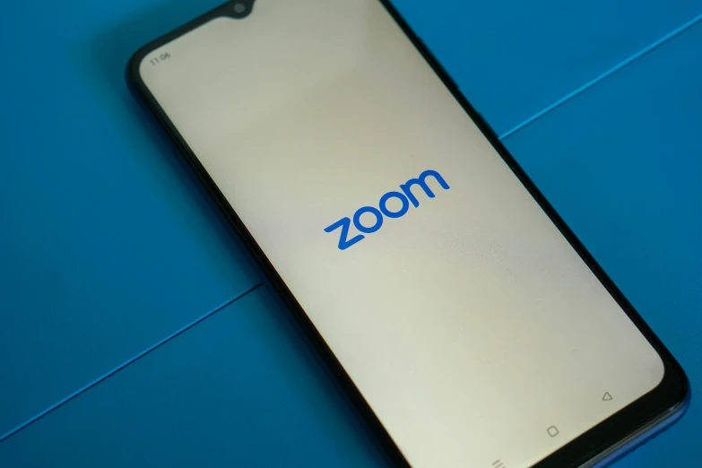 zoom phone on a blue background with the company logo on it