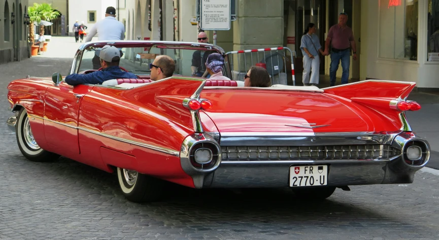 a car is pulling up to a crowd