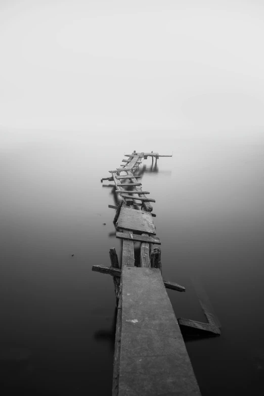 the end of a long pier in a large body of water