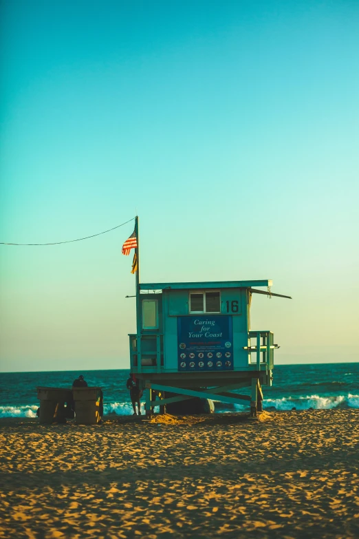 a lifeguard stand on the beach in the ocean