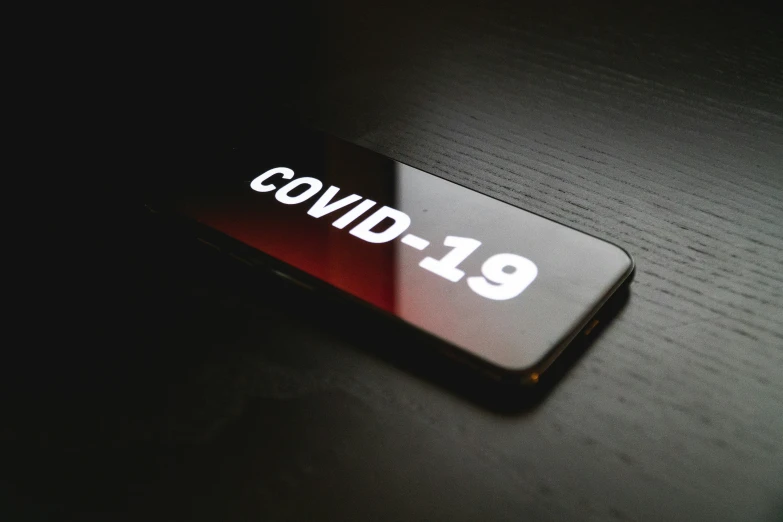 a close up po of the word covidd on a phone