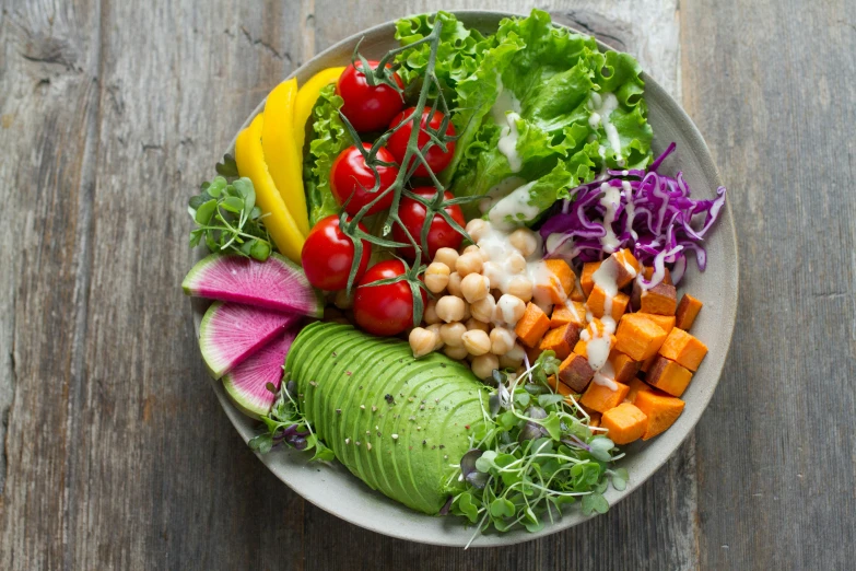 this healthy salad consists of fresh veggies, beans and avocado
