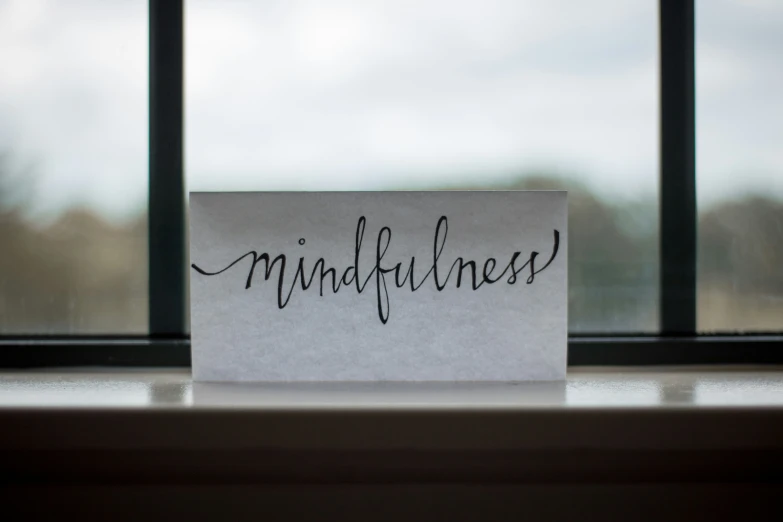 a piece of paper with the word mindfulness written on it