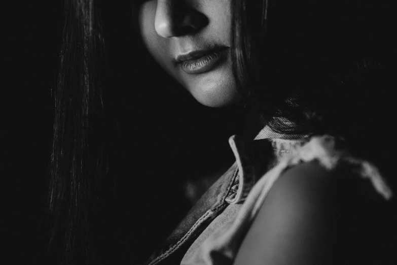 a black and white portrait of a woman with dark hair