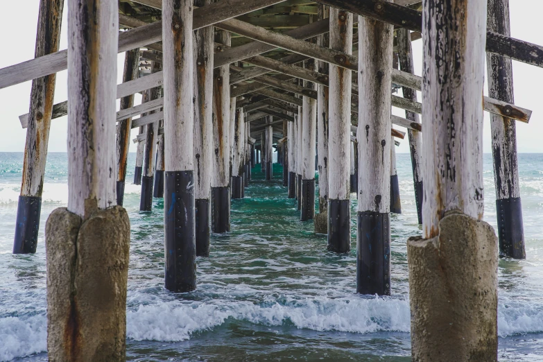 a pier covered in water underneath a large body of water
