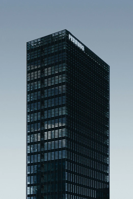 the tall building is made up of many thin window frames