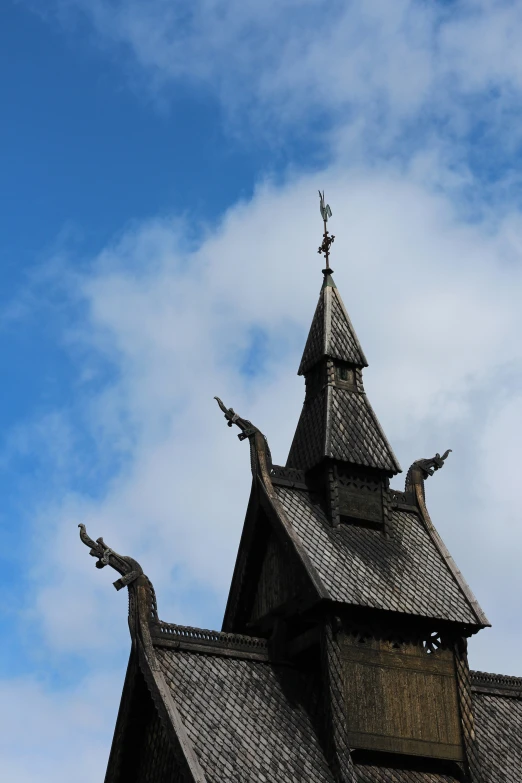 the front of an ornate building with gargoyles on it