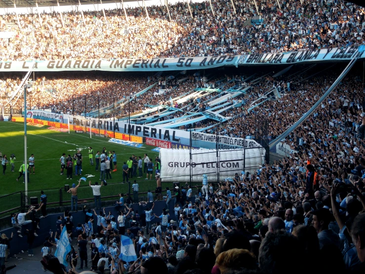 the view from above of a large stadium as the crowd watches on