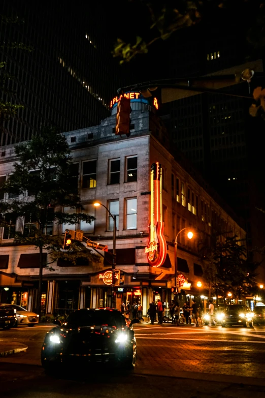 a car is going on a dark city street