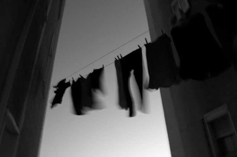 a few clothes that are hanging out the window