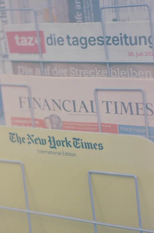 several business and financial times are displayed on billboards