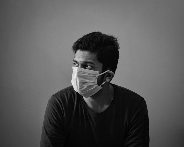 a man wearing a medical mask on his face