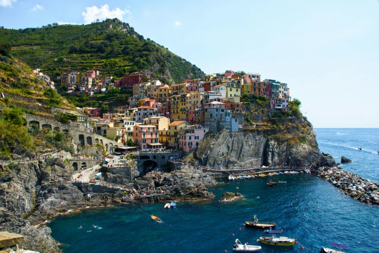 the cliff houses are perched on a narrow part of the bay