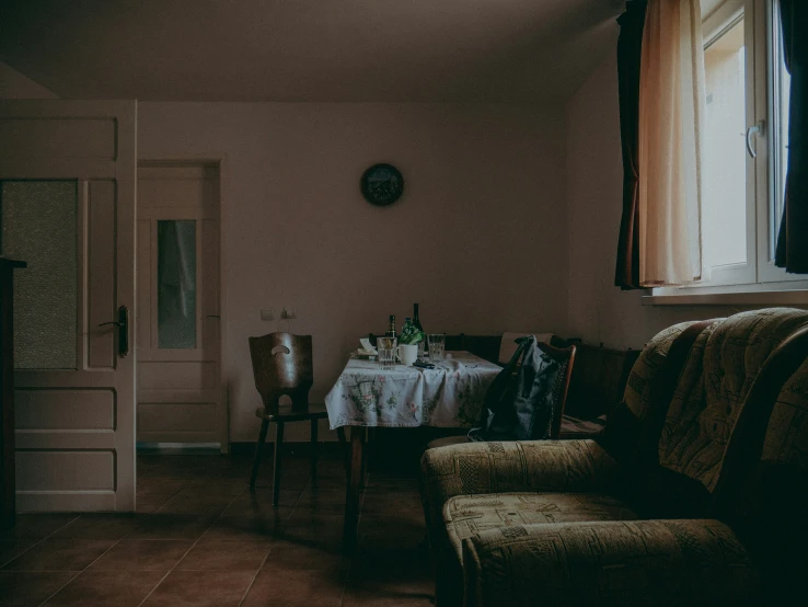 a small table and chairs are in the living room