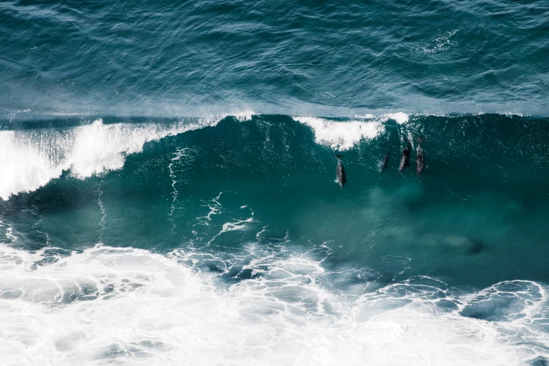 surfers are riding a wave in the ocean