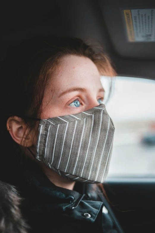 a woman with blue eyes in the car