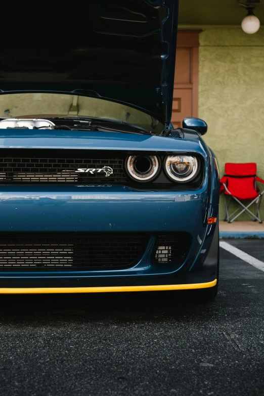 the hood of a car in front of a chair