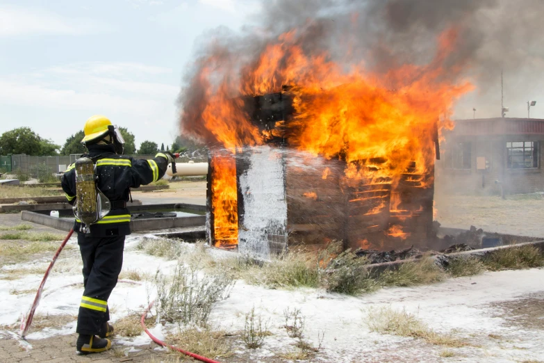 a firefighter is shown in front of a burning fire