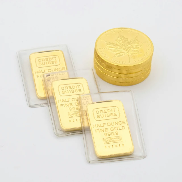 a bunch of gold bars in front of some stacked ones