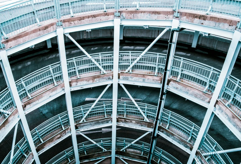 a metal spiral stair gate going into a building