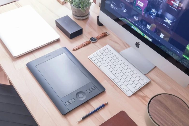 the laptop is placed on the table by its keyboard