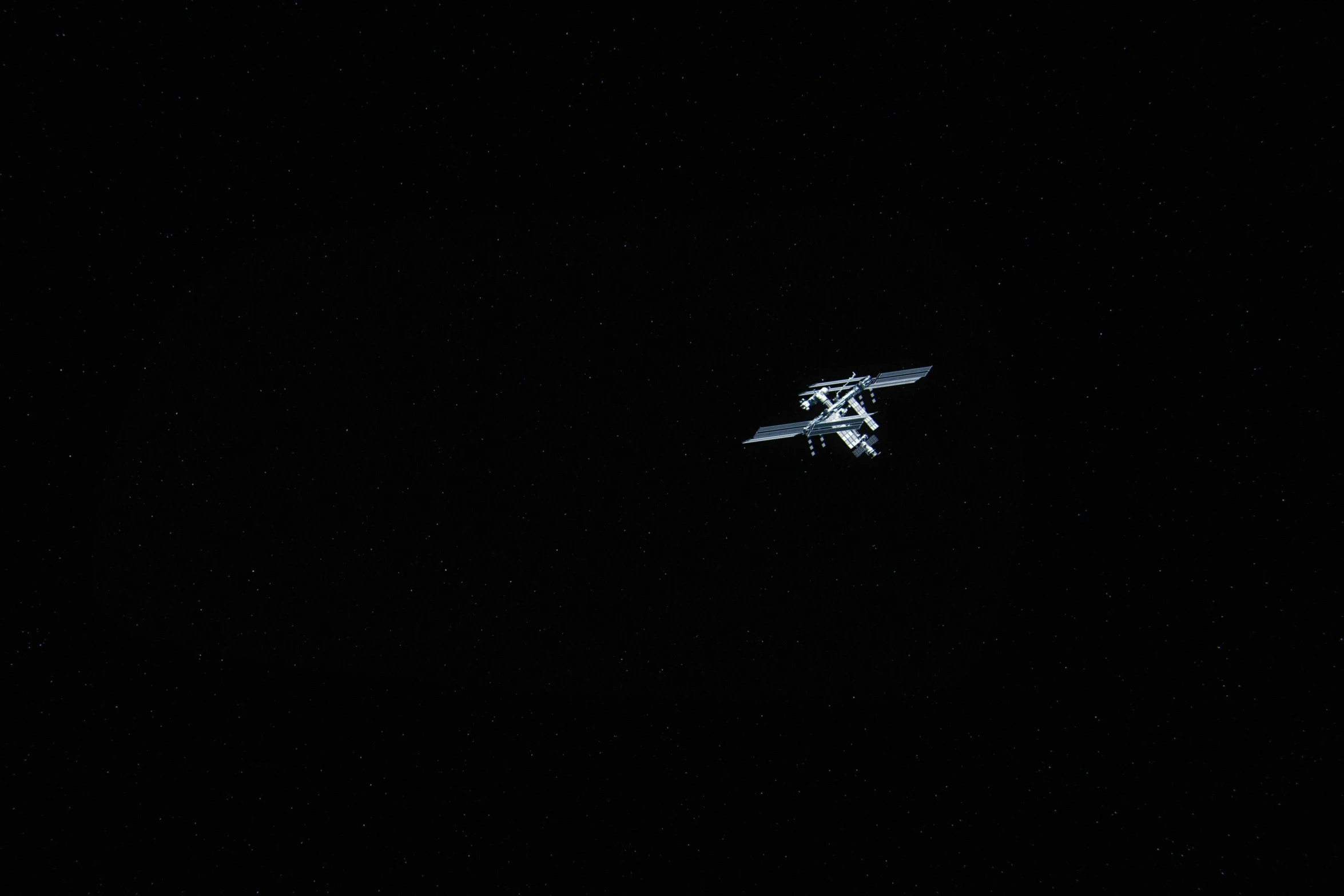 an airplane is flying through the night sky