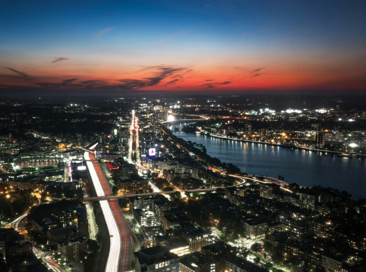 aerial view of city and river at night