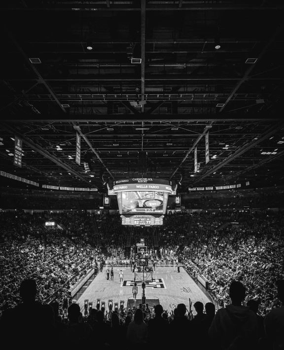 a black and white pograph of a basketball court