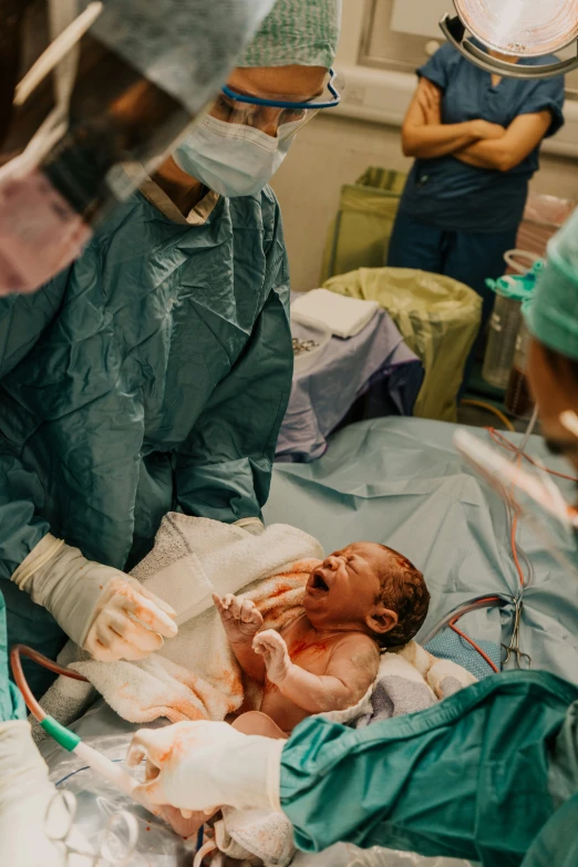 surgeons surrounding the dummy being treated for 