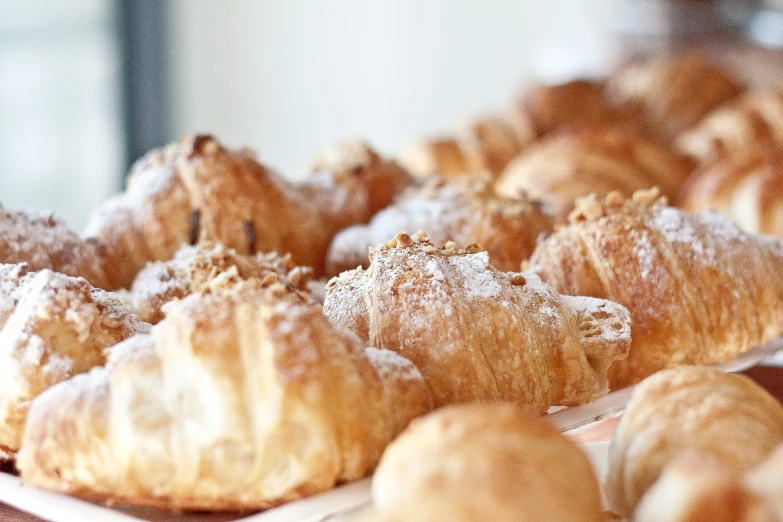 some puff breads in a plate are on a counter