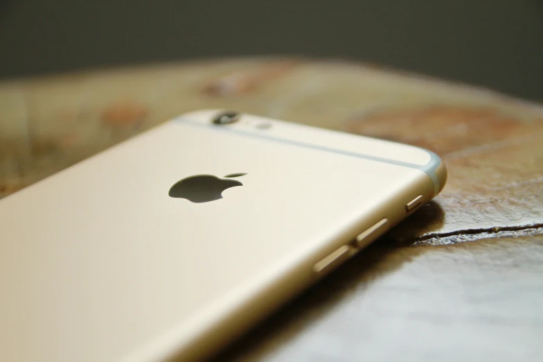 an image of apple logo iphone on a table