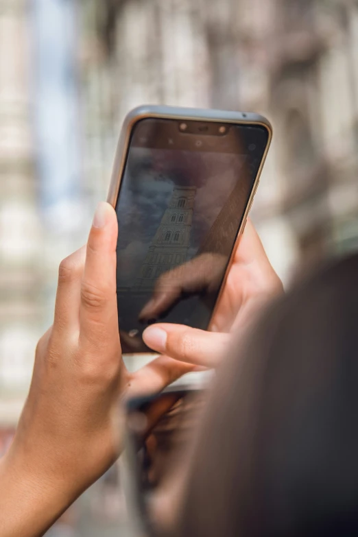 a person with their hands on a cellphone