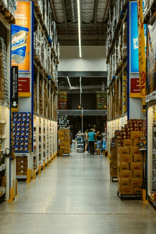 a long warehouse with boxes in it