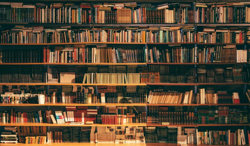 an old bookshelf filled with books in a liry