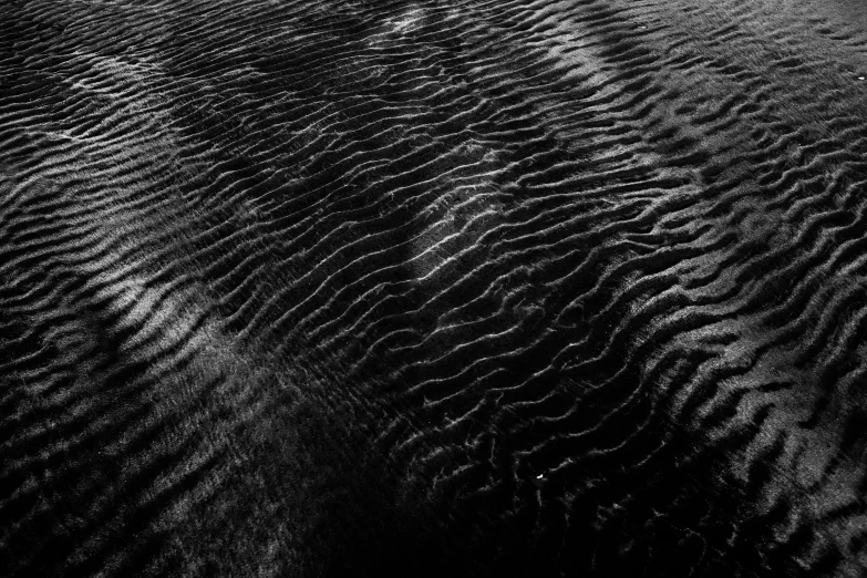 ripples in water moving towards the top of a mountain