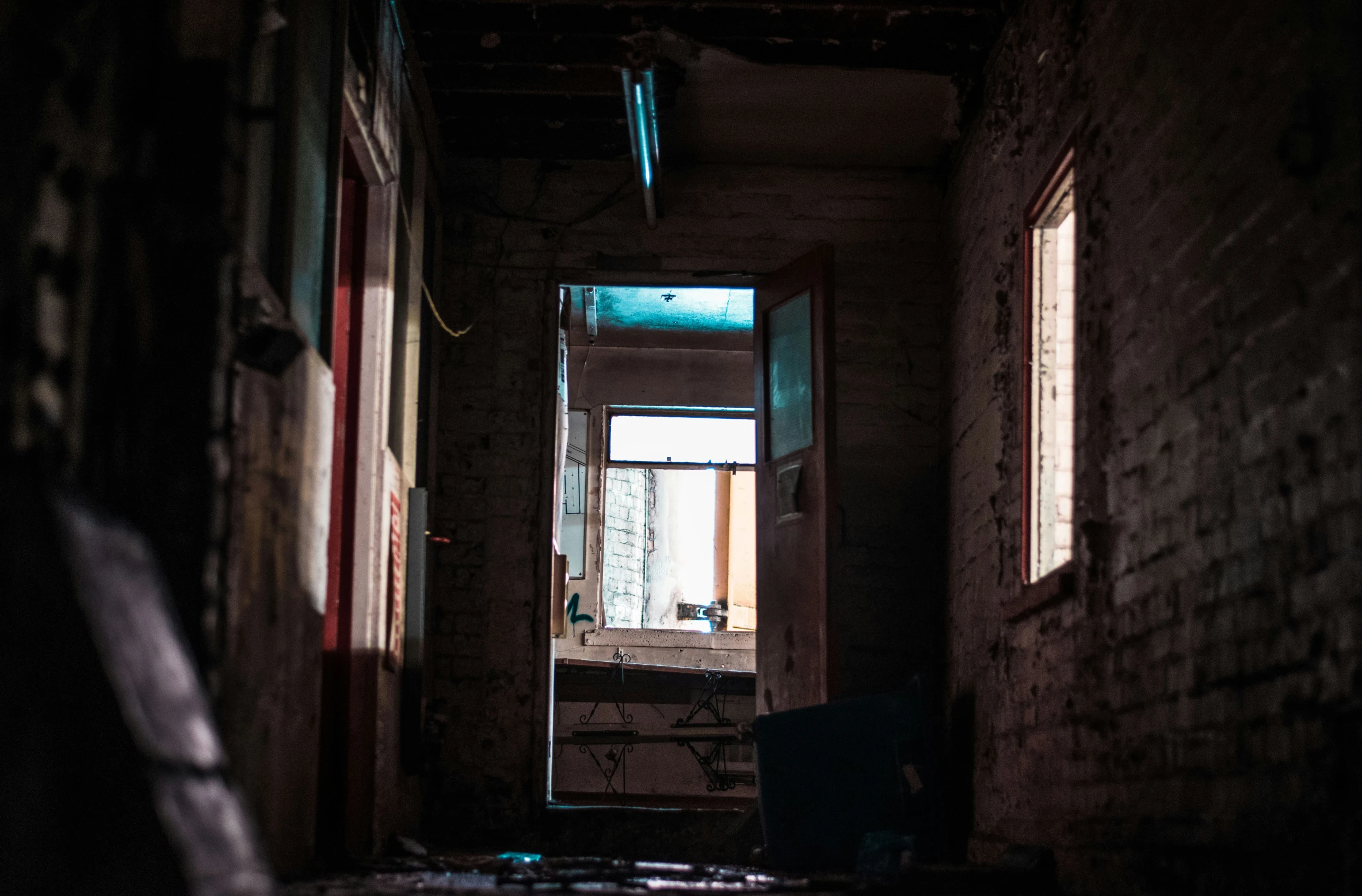 an old house with a broken down door and windows