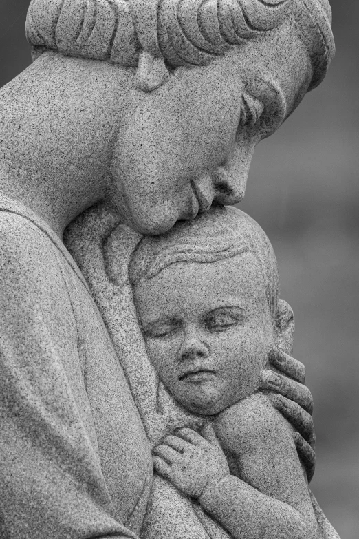 black and white po of woman with child looking at camera