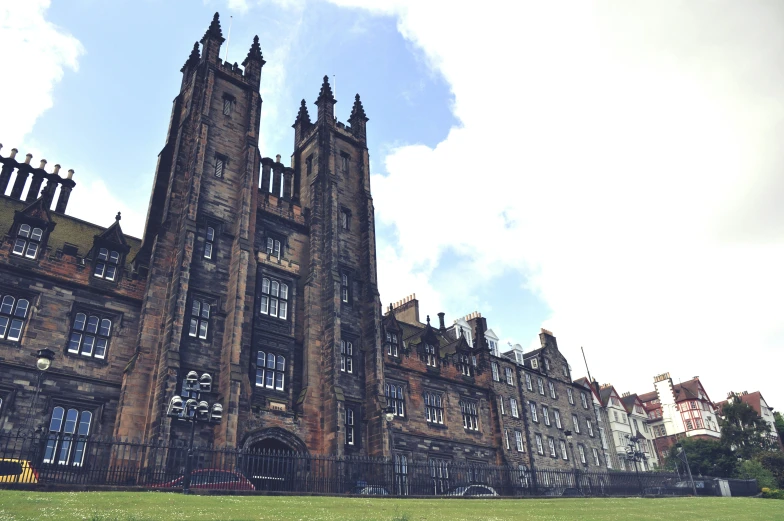 an old building is in the middle of a park