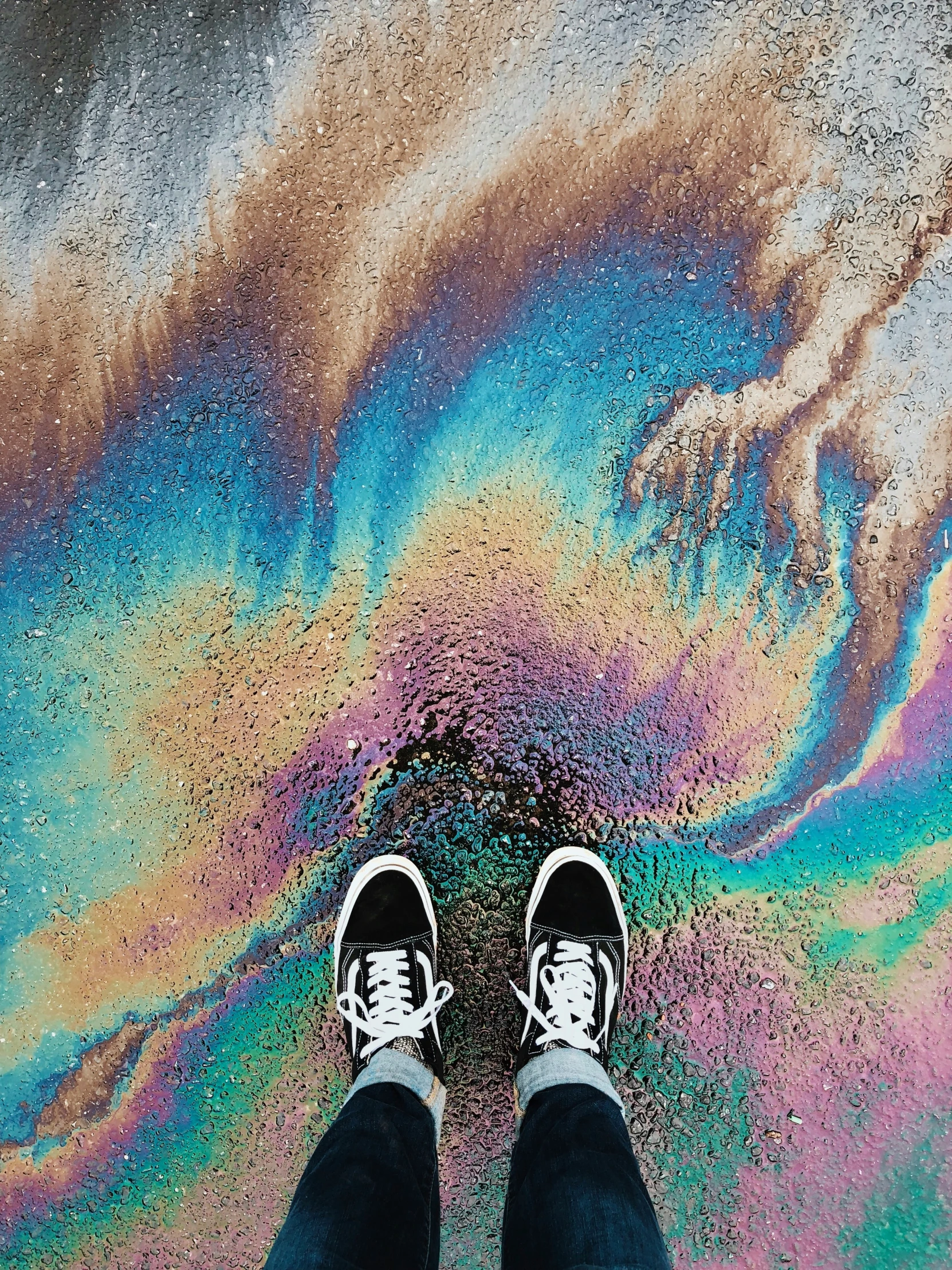 a man with black and white shoes is on the floor