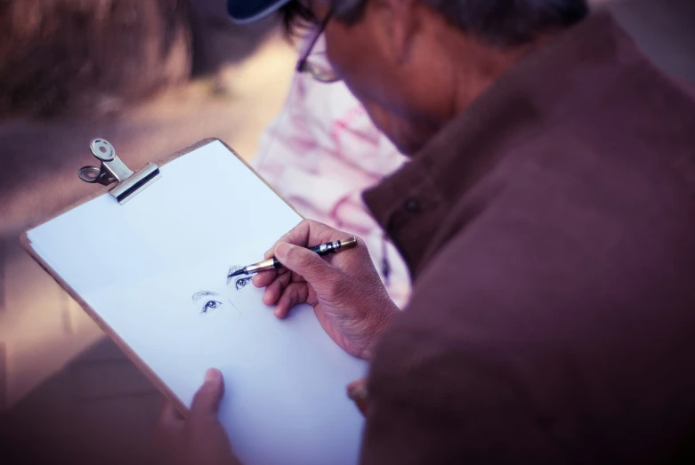 a person writing in a notebook