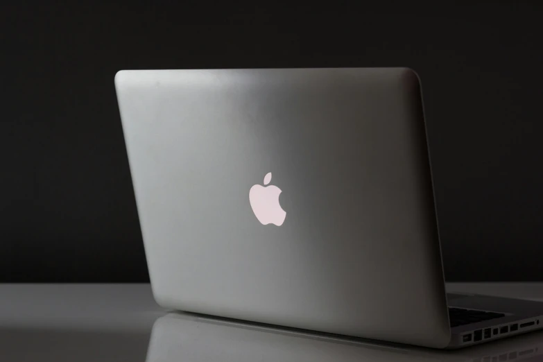 an apple macbook air laptop sits open