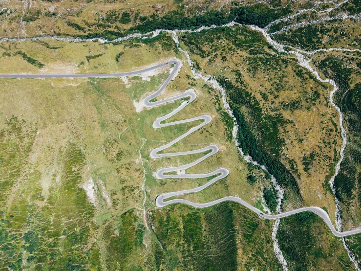 an aerial view shows the river and highway curves