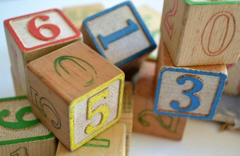 a toy with wooden blocks and numbers on it