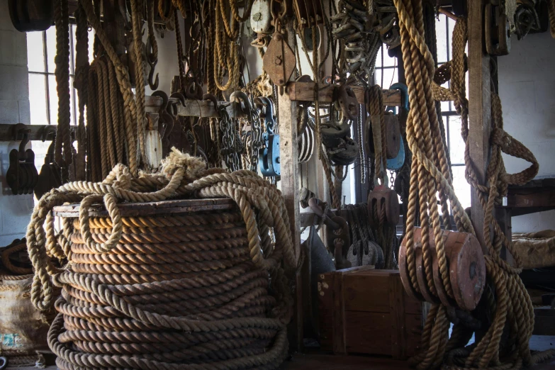 a tower of rope covered baskets in a room