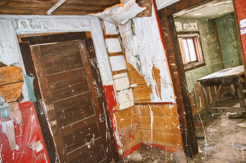 a room that is covered in paint and peeling paint