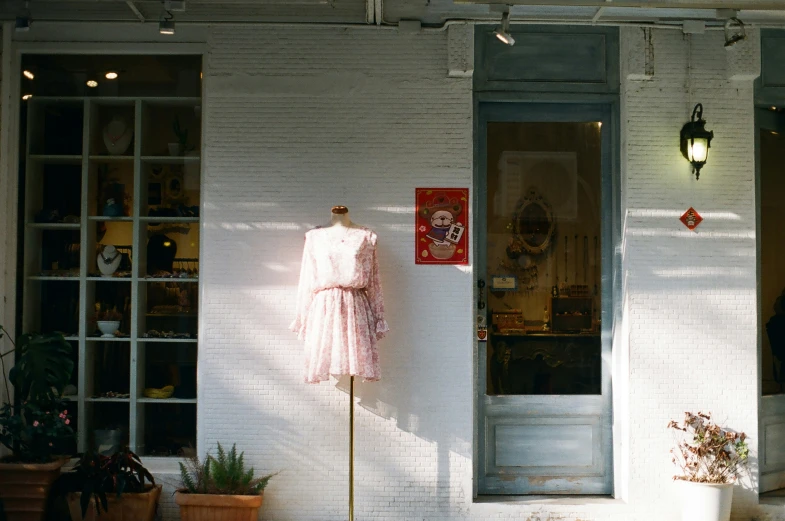 a dress that is hanging out a window