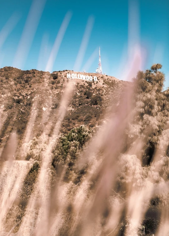 a small tower on top of a hill with trees