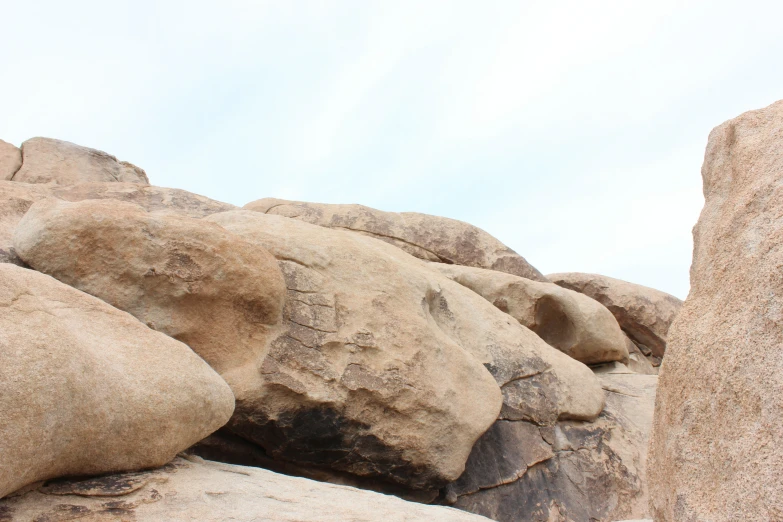 the large boulder is set at the edge of the clear sky