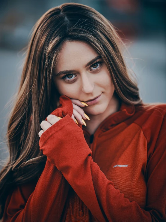 a beautiful young woman leaning on her arm